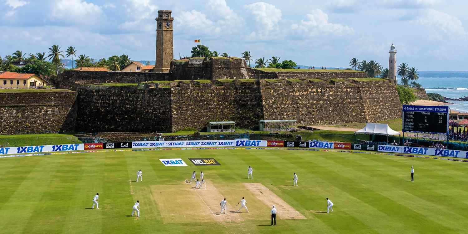 Galle International stadium with Galle Fort and clock tower overlooking a Test cricket match